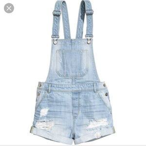 Distressed denim bib overalls